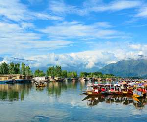 Srinagar, India - July 23, 2015: Many traditional boats waiting for tourists in the Dal lake of Srinagar, Jammu and Kashmir, India. Dal lake is integral to tourism and recreation in Kashmir.